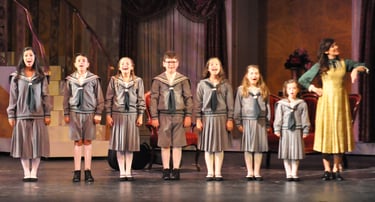 a group of people standing on a stage