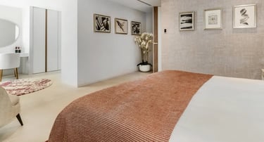 Bedroom with warm tones and garden view at Villa Serenity