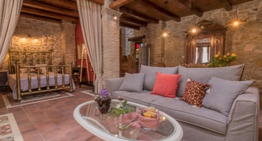 Spacious living area with three seats sofa and coffee table in Villa Galanoussa