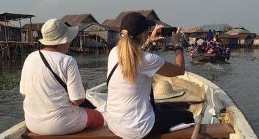 Tourists Visiting Ganvie stilt village during a Multi-country Trips of Senegal, Ivory Coast & Benin