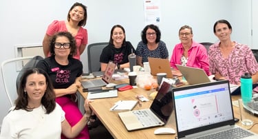 Small business owners participating in a beginner-friendly digital workshop with laptops notebooks