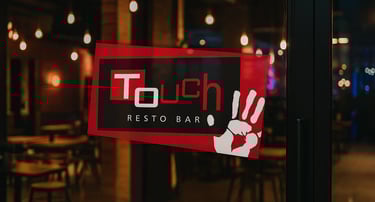 a sign that says touch restaurant and resto bar