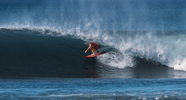 a person riding a surfboard in the ocean