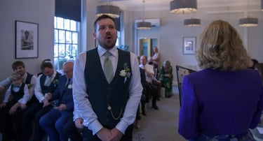 Groom waiting for his bride at Bury St Edmunds Registry Office.