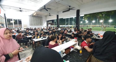a group of people sitting at tables in a room