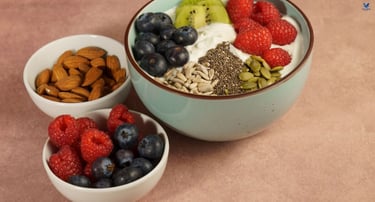 Balanced breakfast with Greek yogurt, blueberries, kiwi, and almonds for a healthy blood sugar.