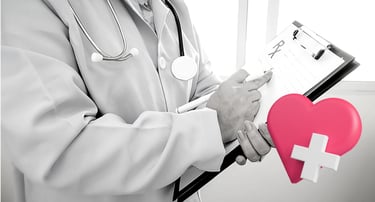 a doctor holding a heart shaped piece of paper
