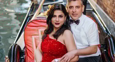 Couple by gondolas in Venice