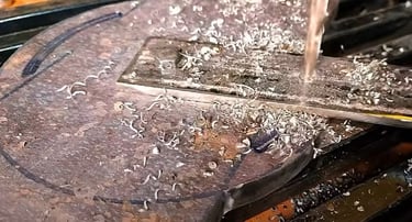 Picture showing the drilling of a compound slide base