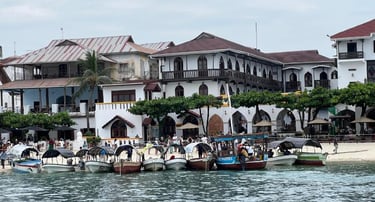 Stone Town Zanzibar walking tour through historic alleys, carved wooden doors, and vibrant local markets