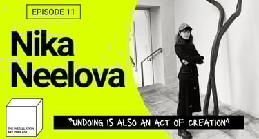 Artist Nika Neelova with her work