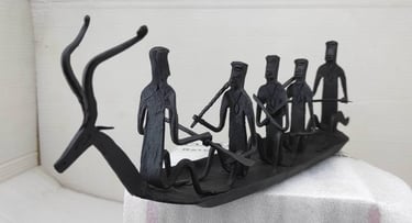 "Handcrafted tribal iron boat with 5 seated figures – Bastar Loha Shilp, left side view-Export-grade"