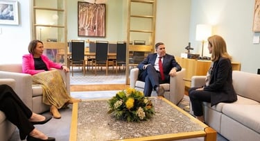 a group of people sitting around a table