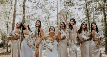 happy bride and bridal party because they hired a great wedding coordinator