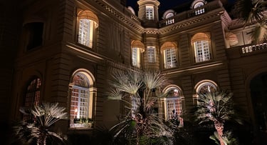 a large building with a lot of windows and lights