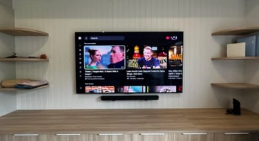 Professional 85 inch LG OLED TV wall mount installation with floating shelf in Brighton Melbourne