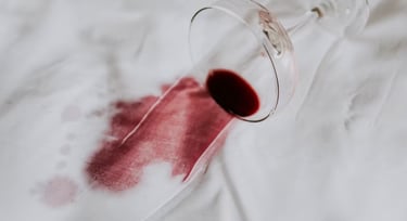 A red wine stain on a white fabric