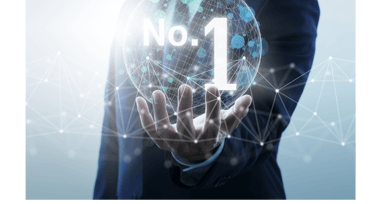 a man in a suit and tie is holding a no 1 sign