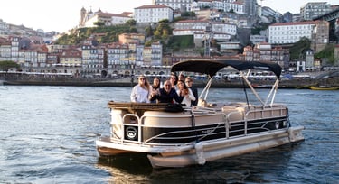 Private pontoon boat cruising on the Douro River in Porto