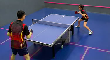 Adult table tennis training session focused on fitness, technique, and social play