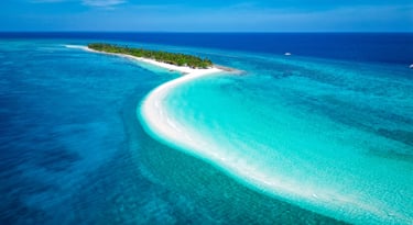 a small island with a small island in the middle of the ocean