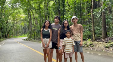 A group of people in the Man-made Forest of Bohol, Philippines.