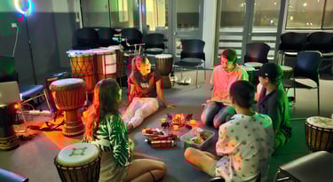 african drumming and surrounded pople