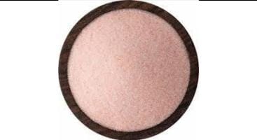 Himalayan pink salt chunks showing natural texture and crystal structure