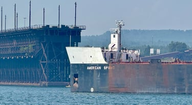A close-up of the bow of freighter American Spirt in front of the Two Harbors Ore Dock.