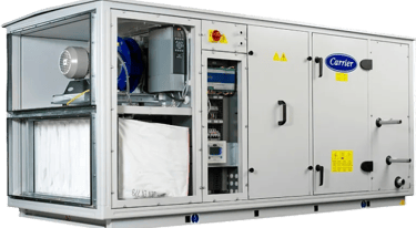 Industrial Carrier air handling unit with open panels showing filters, motor, and control systems.