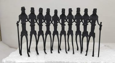 "Handcrafted tribal iron art sculpture of 10 Adivasi dancers performing group dance – front view-Prepared for export"