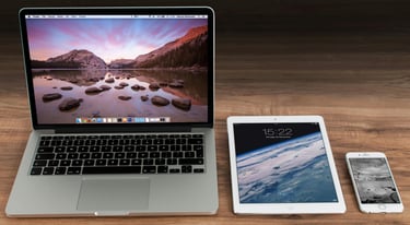 laptop tablet and phone on table