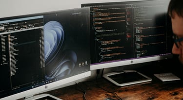 man working on screens