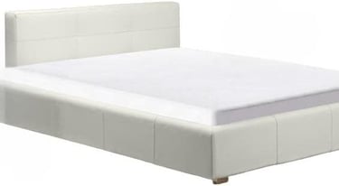 a bed with a white bed and a white bed