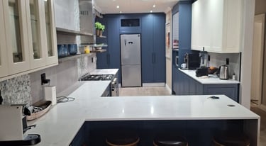 a kitchen with a counter top and stools