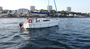 Private sailing boat cruising on the Douro River in Porto