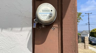 Exterior electric panel mounted on side of houes