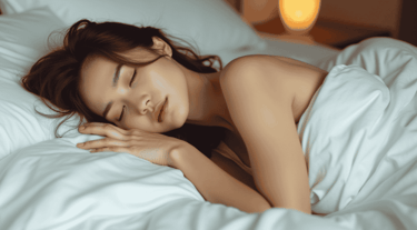 a woman is sleeping in a bed with her eyes closed