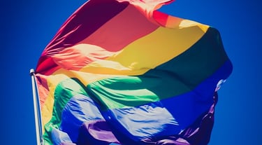 a rainbow - colored flag with a rainbow - colored flag