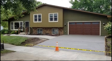 Concrete driveway and concrete sidewalk addition.