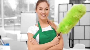 a woman in green aprons holding a green duster