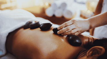 a woman getting a massage at a spa