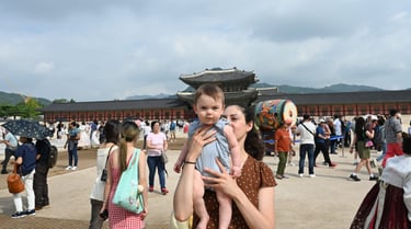 a woman holding a baby