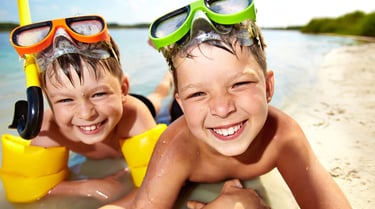 two boys in snorly goggles and snorkers