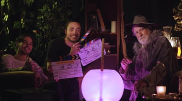 a man in a hat and a film crew