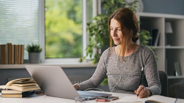 Adult learner researching education options on a laptop