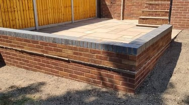 garden wall in the back of a worcester garden by B R Building and Landscapes