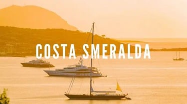 Luxury yacht illuminated by the golden light of sunset on the emerald sea of Sardinia’s northeastern