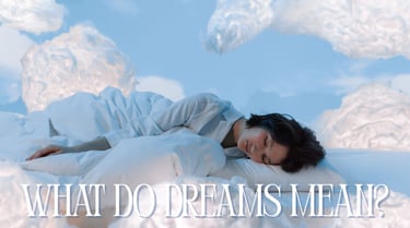 a woman laying on a bed with a sky background