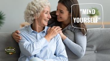 Classic Irish mam image showing a grandmother with granddaughter and the phrase "Mind yourself"